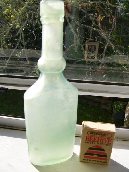 Cloudy well-shaped vintage bottle Carousel 1
