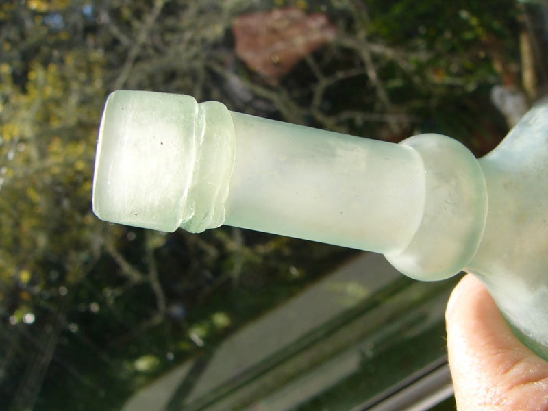 Cloudy well-shaped vintage bottle Carousel 2