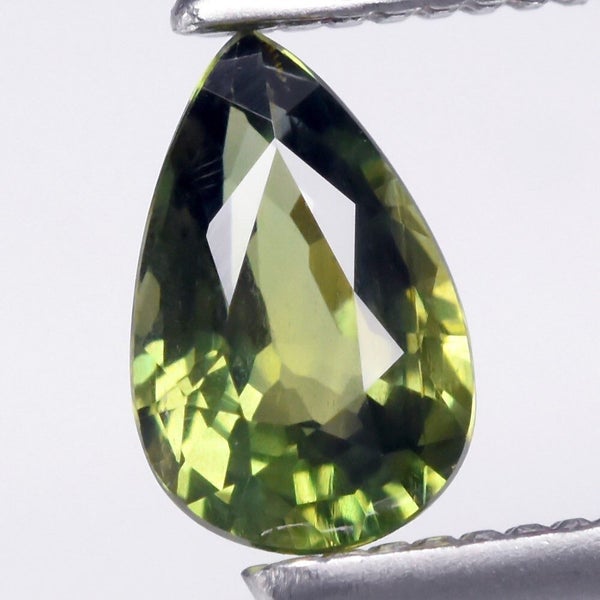$1 RES * Buy Now $1,200.00 * 0.45ct Unheated Pear Green Sapphire Loose Gemstone Carousel 1