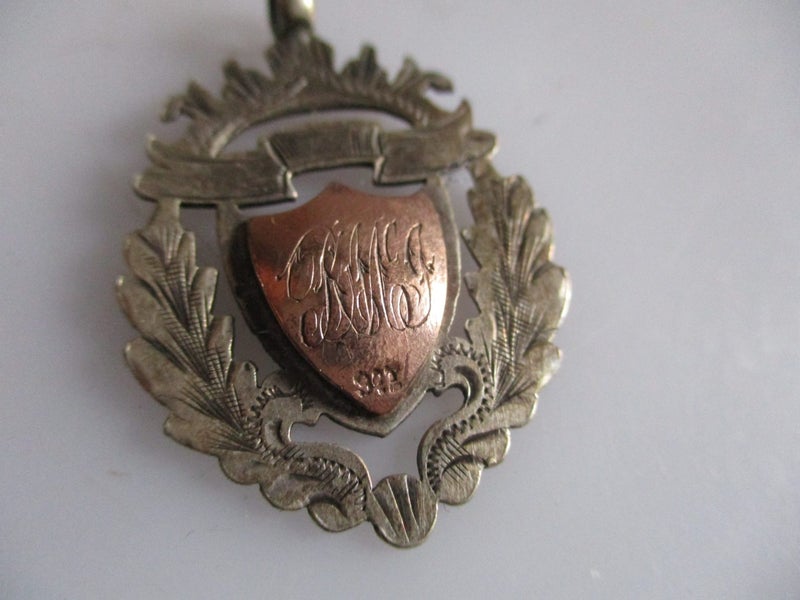 1924 sterling silver with 9ct gold on mid front medal or pendant Carousel 1