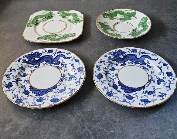 A Small Collection of English Made Chinese Dragon Plates with Gilded Rims. Carousel 1