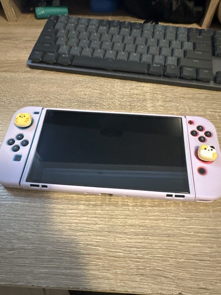 Nintendo Switch OLED + 64gb SSD + pro controller Carousel 1