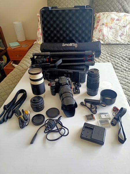 Sony Alpha 100 CCD Camera Kit with 4 lenses, accessories, tripod, and case63003959066242110