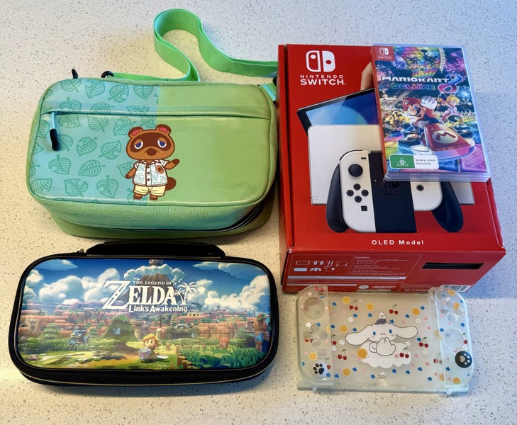 Nintendo Switch Oled + Mario Kart + accessories. Mint condition. Carousel 1