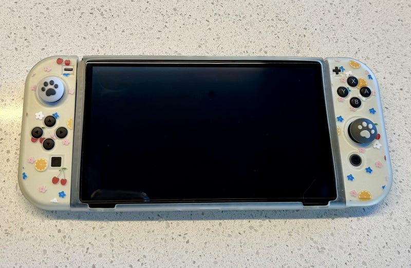 Nintendo Switch Oled + Mario Kart + accessories. Mint condition. Carousel 2