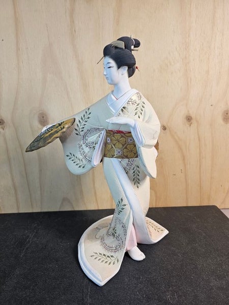 Hakata doll. A traditional clay Doll from Fukuoka. Unglazed white clay. Carousel 1