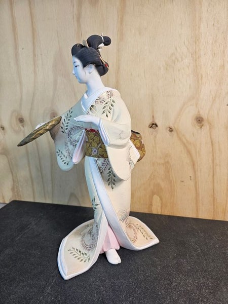 Hakata doll. A traditional clay Doll from Fukuoka. Unglazed white clay. Carousel 2