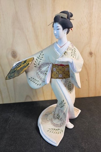 Hakata doll. A traditional clay Doll from Fukuoka. Unglazed white clay. Carousel 10