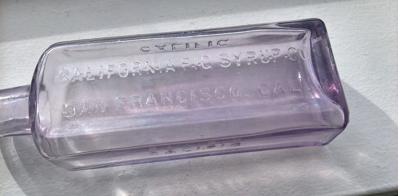 CALIFORNIA FIG SYRUP ANTIQUE AMETHYST COLORED GLASS MEDICINE BOTTLE 1890s/1900 Carousel 1