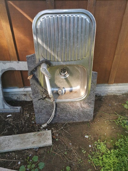 Broken kitchen bench and sink. Carousel 2