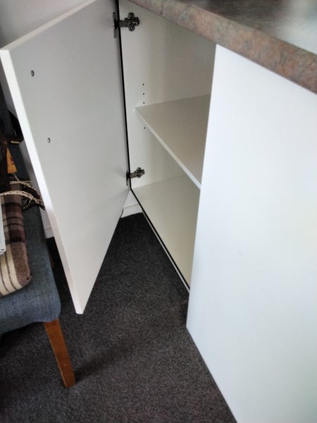 Kitchen sink and benchtop with cupboards. Carousel 1