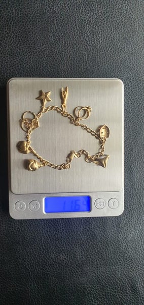 9ct gold charm bracelet Carousel 1
