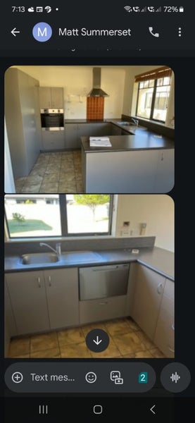 Modern kitchen including appliances rangehood and waste disposal . Carousel 1