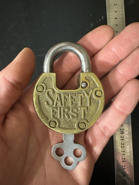 $1 reserve. Beautiful condition vintage "SAFETY FIRST" brass padlock with key. Carousel 1