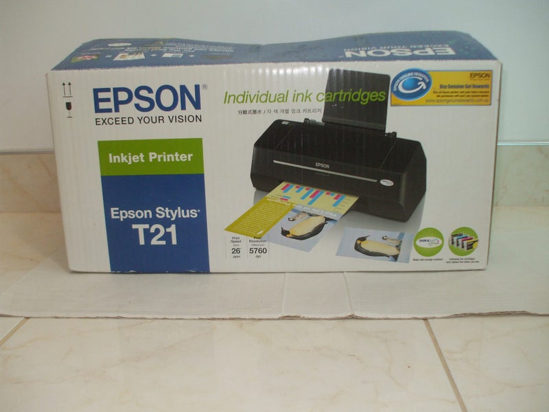 EPSON PRINTER in as new Condition (Still in the plastic cover,26 page per minute Carousel 1