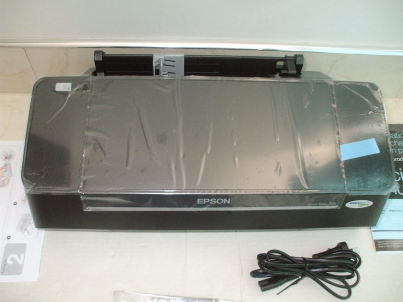 EPSON PRINTER in as new Condition (Still in the plastic cover,26 page per minute Carousel 6