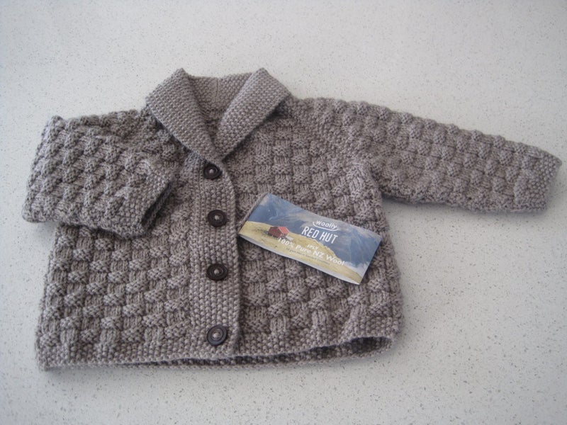 Jacket with a collar handknitted in double knit wool. Carousel 1
