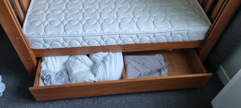 Cot - solid timber with sliding front rail and storage drawer Carousel 5