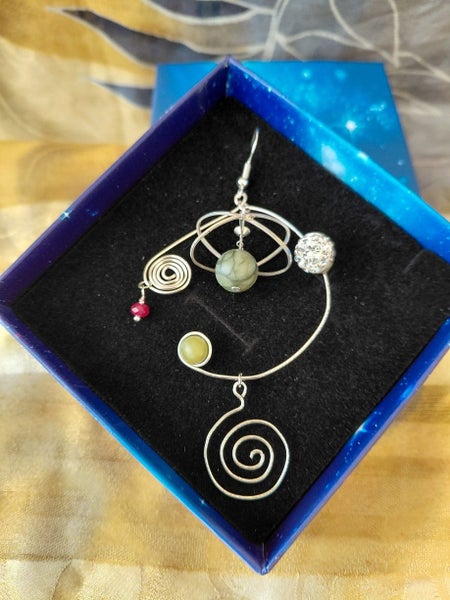 Pleiades kinetic pounamu & garnet earrings for Matariki Carousel 1