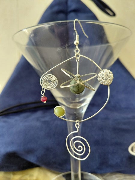 Pleiades kinetic pounamu & garnet earrings for Matariki Carousel 2