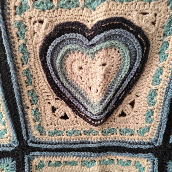 Heart shaped granny square baby blanket in grey and shades of blue Carousel 2