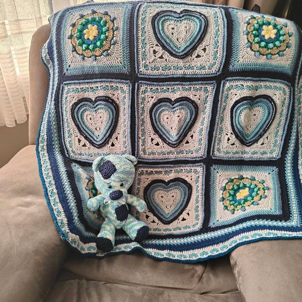 Heart shaped granny square baby blanket in grey and shades of blue Carousel 4