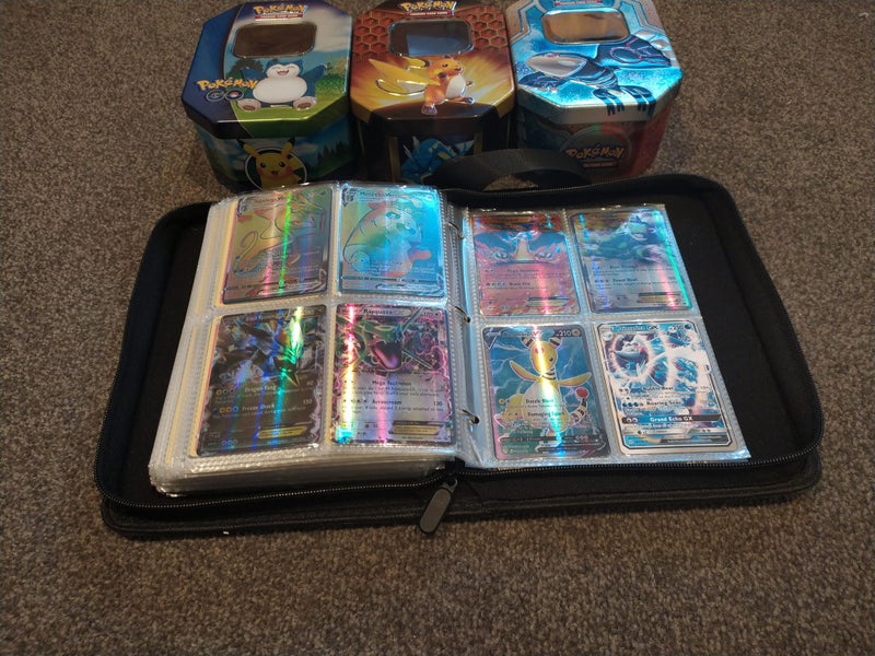 Pokemon collection mixed - approx 300 cards, 3 tin cases and 1 Charizard binder Carousel 1