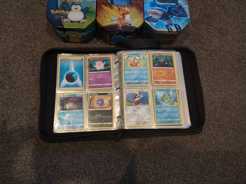 Pokemon collection mixed - approx 300 cards, 3 tin cases and 1 Charizard binder Carousel 6