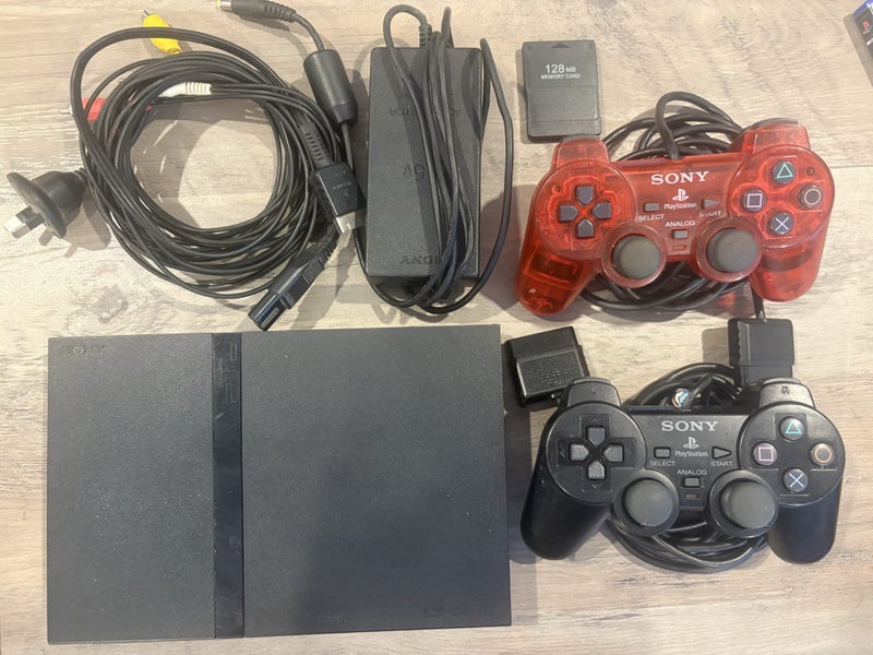 Slim PS2 bundle W sing star mics and 4x games. Carousel 1