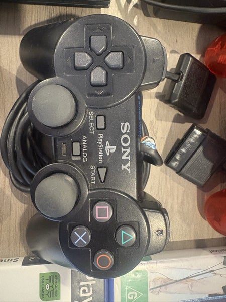 Slim PS2 bundle W sing star mics and 4x games. Carousel 5