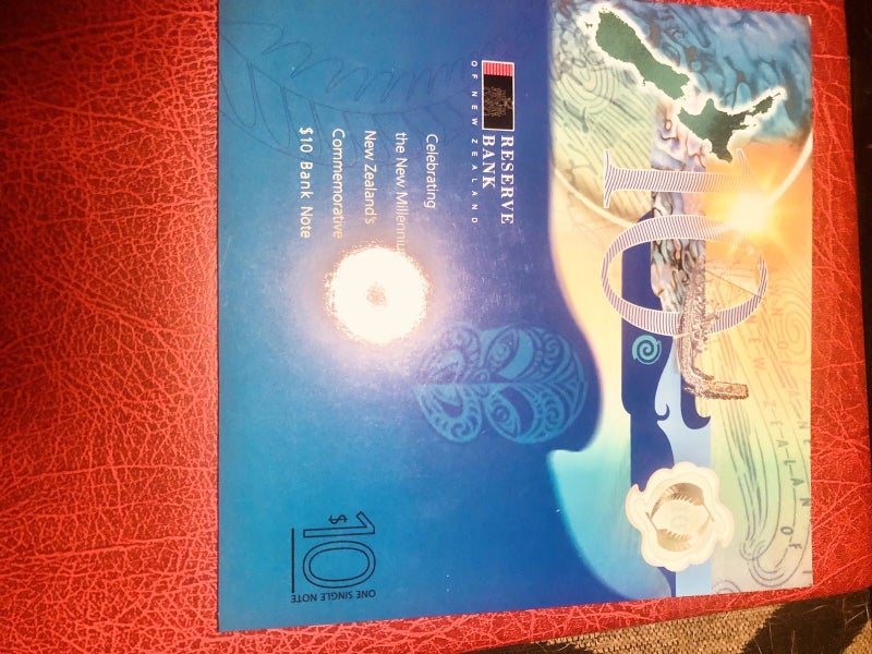 Single red serial millennium $10 in large folder628543159205131112