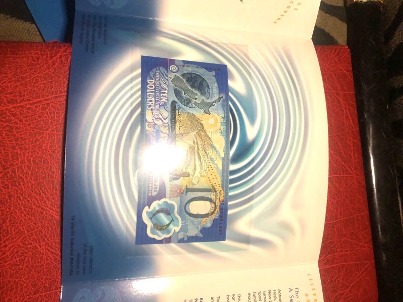 Single red serial millennium $10 in large folder62854315920513111