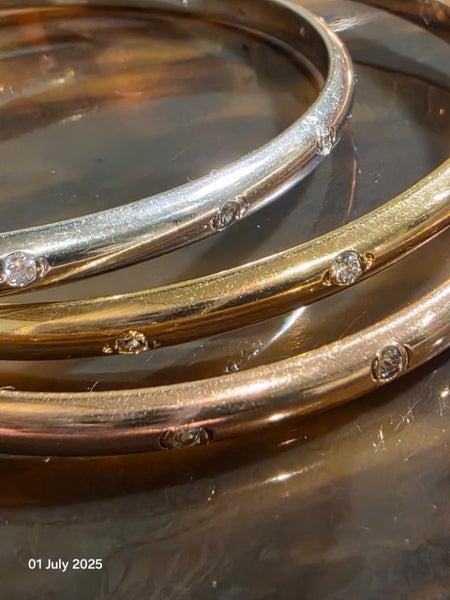 $1 Three Entwined Bracelets with Cubic Zirconias 52.54gm62935702481026111