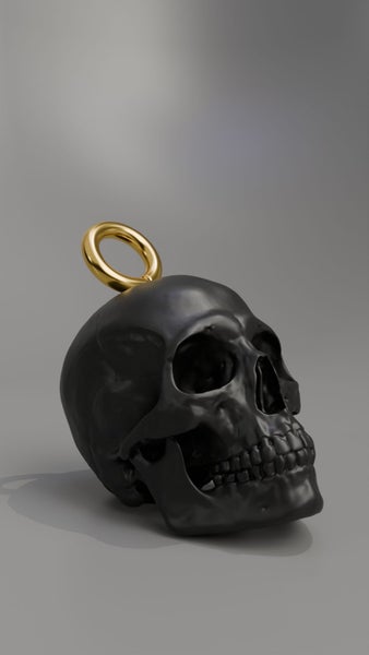 Black Skull Keychain with Gold Ring Carousel 1