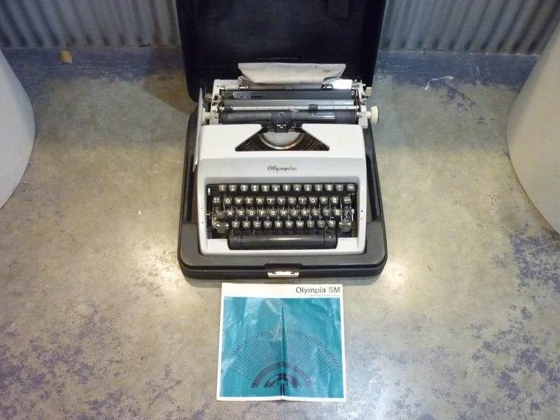 OLYMPIA PORTABLE TYPEWRITER. CASED. Carousel 1
