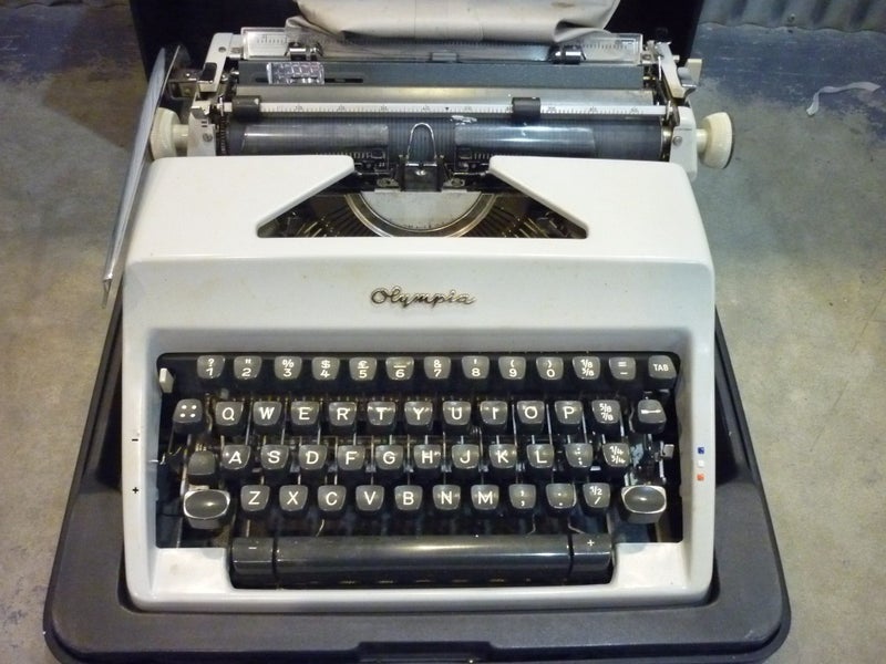 OLYMPIA PORTABLE TYPEWRITER. CASED. Carousel 2
