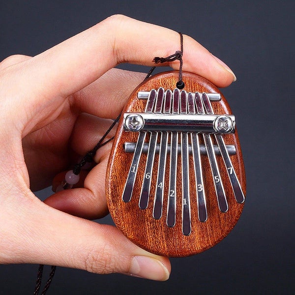 High Quality 8 Key Mini Kalimba Exquisite Finger Thumb Piano Marimba Musical Go Carousel 2