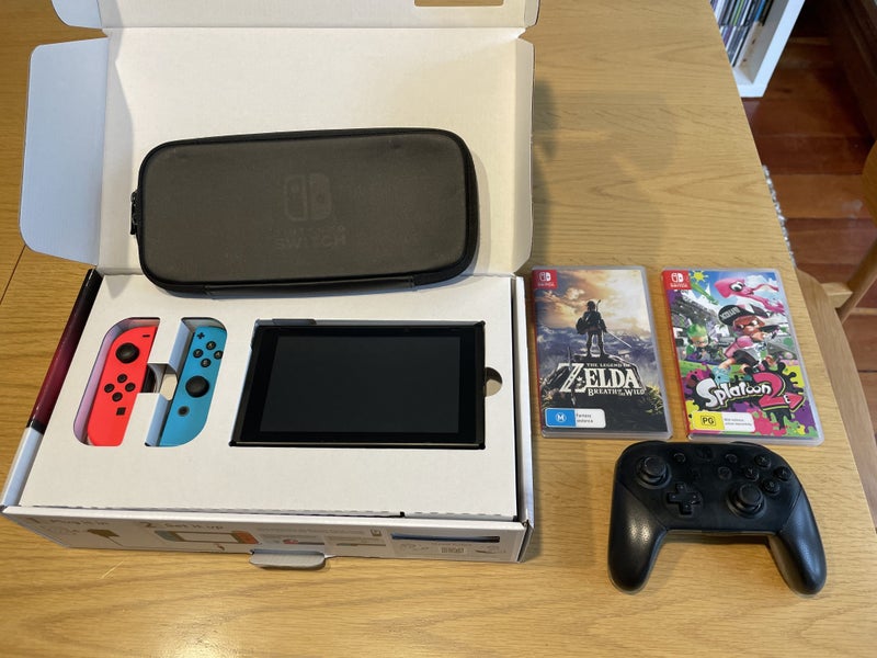 Nintendo Switch with Pro Controller, Zelda Breath of the Wild and Splatoon 2 Carousel 1