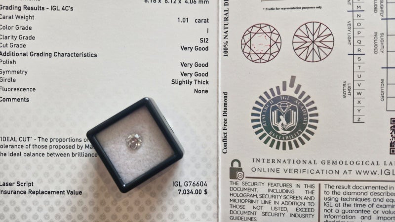 $1 RES * Valuation $11,670.00 * 1.01ct Round Large White Diamond Loose IGL CERT Carousel 1