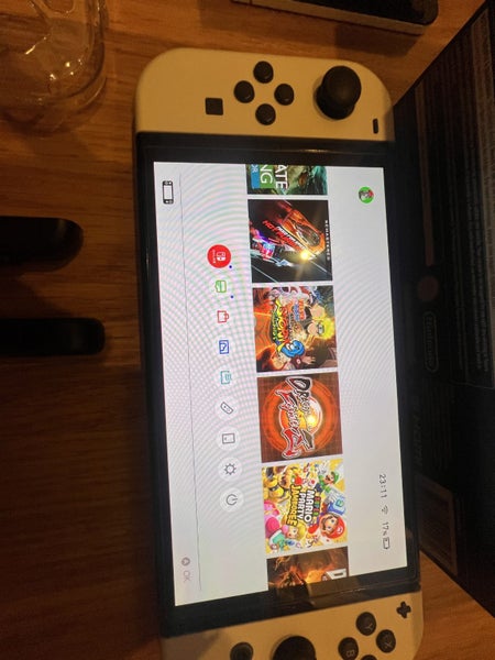 $1 RESERVE – Nintendo Switch OLED + Heaps of Games!62966411134851114