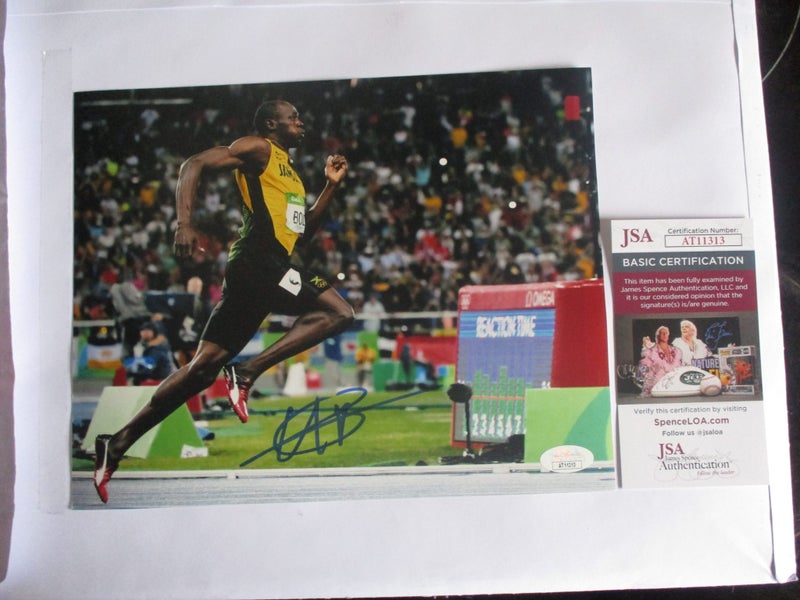 Usain Bolt "Fastest Man on Earth/ 8 x Olympic Gold signed Photo + AUTHENTICATION Carousel 1