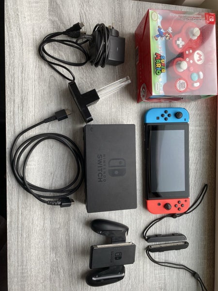 Mint condition Nintendo Switch Console bundle with Mario controller and extras Carousel 1