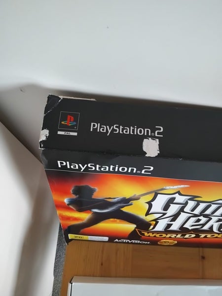 Playstation 2 with games + guitar hero in box with everything included. AllWorks62993530780417113