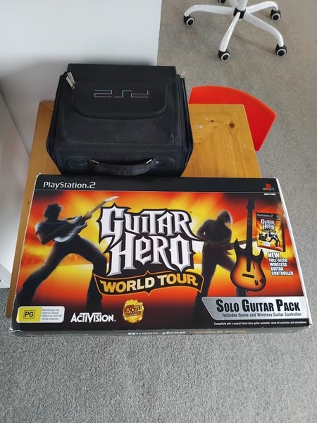 Playstation 2 with games + guitar hero in box with everything included. AllWorks62993530780417112