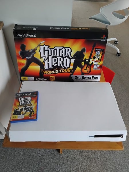Playstation 2 with games + guitar hero in box with everything included. AllWorks62993530780417114
