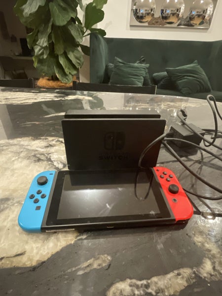 Nintendo switch with charger and 100$ game Carousel 1