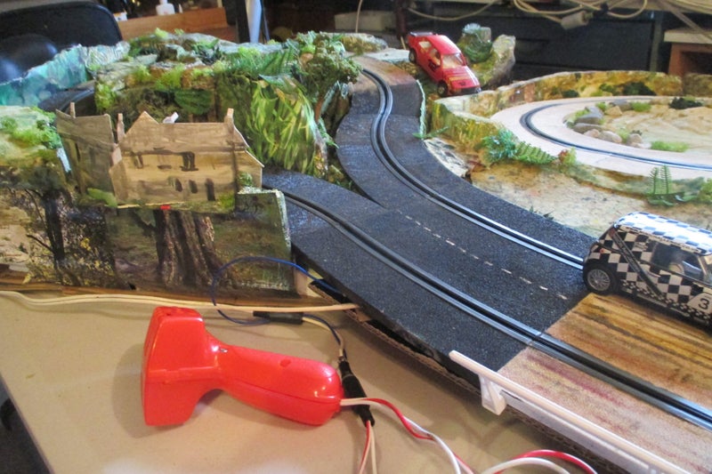 Slot car track 1/32 landscaped single lane rally track with 2 cars Carousel 2