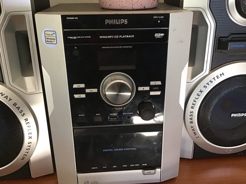 CDs in 2 Wooden Holders + Phillips Stereo with 4 Speakers Carousel 6