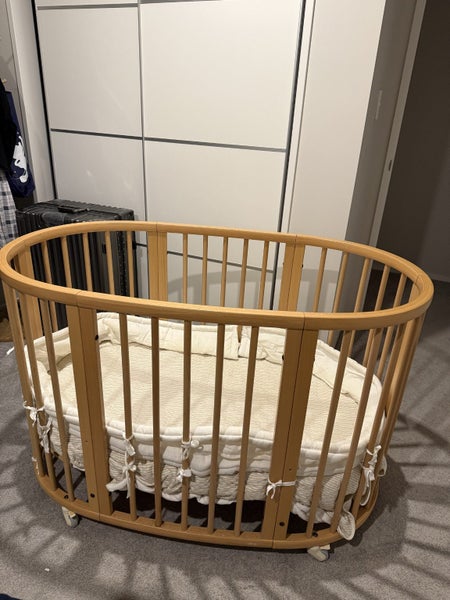 Stokke Oval Beech Wood Cot with Mattress Carousel 1