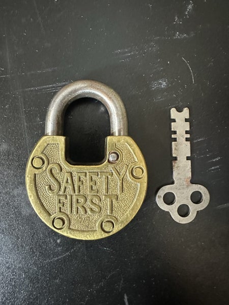 $1 reserve. Beautiful condition vintage "SAFETY FIRST" brass padlock with key. Carousel 11